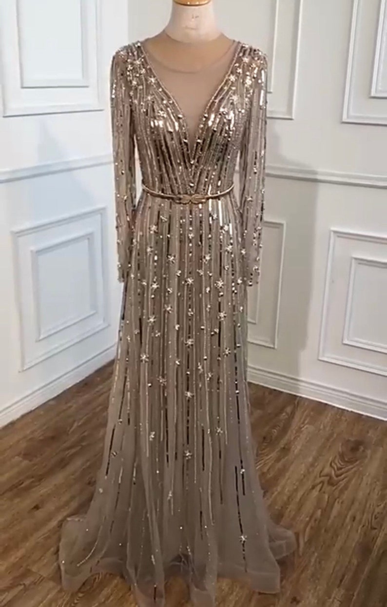 sequin dress dubai The V-Neck Sequin Midi Dress